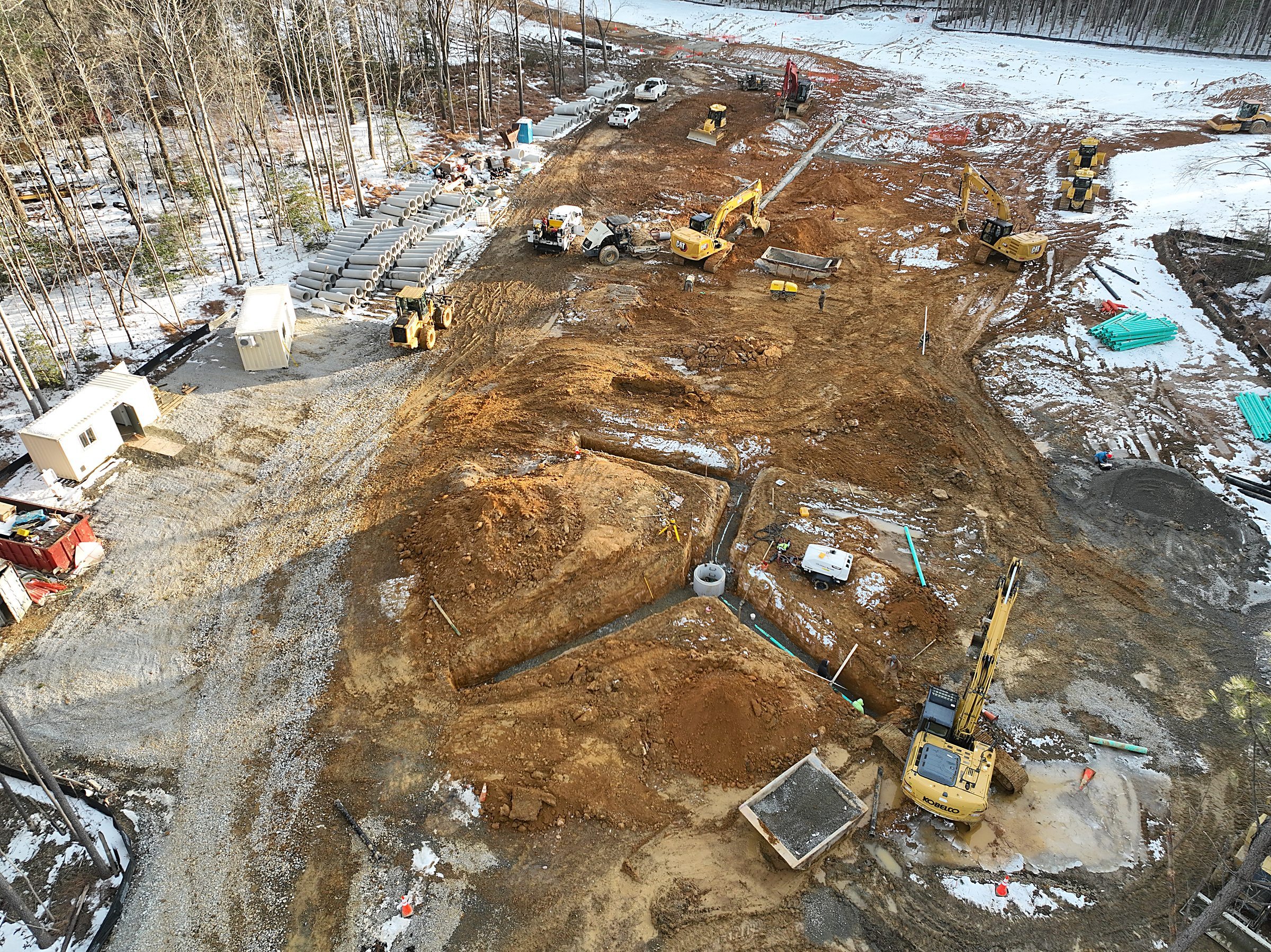 Dedicated crews and equipment installing utilities in winter at Meadow Springs Run