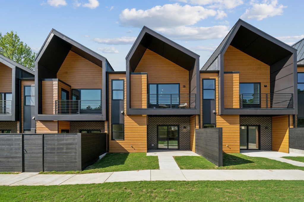 Chestnut Flats, Richmond: inverted-gable townhomes in wood-look siding and standing-seam metal