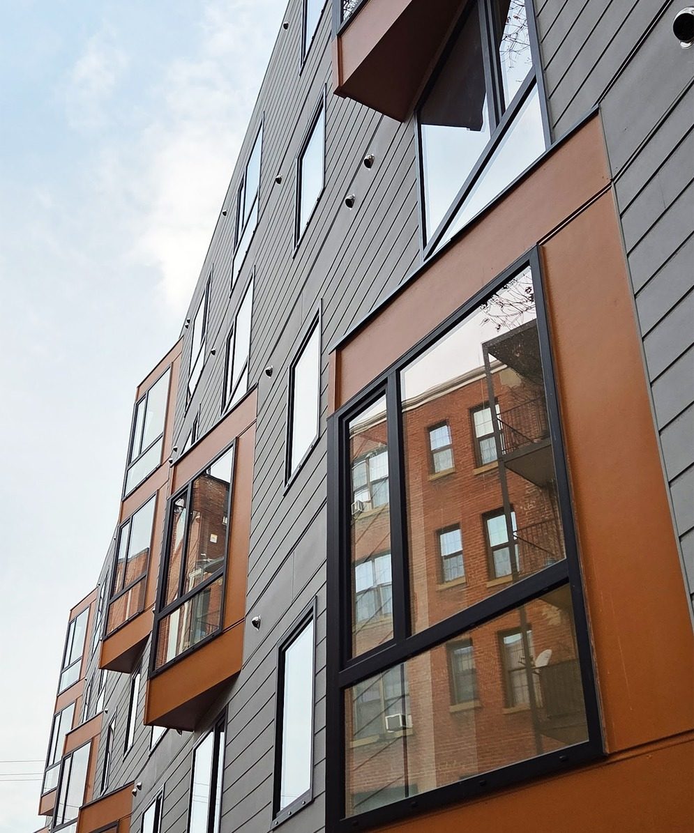 The Bowen, Washington: bronze bay windows set into a fiber-cement facade