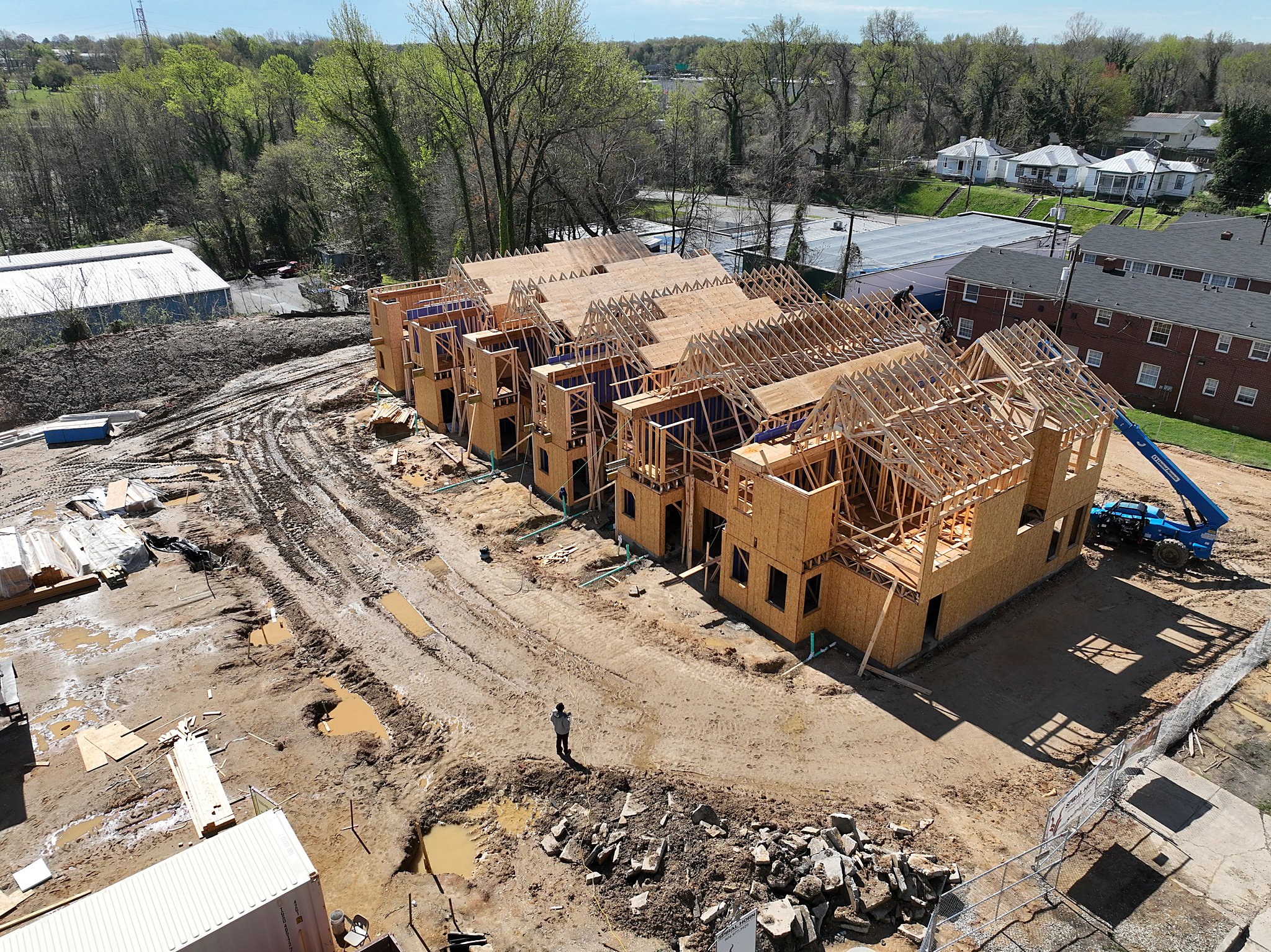 Roof trusses and framing crews at work on a Chestnut Flats building under construction